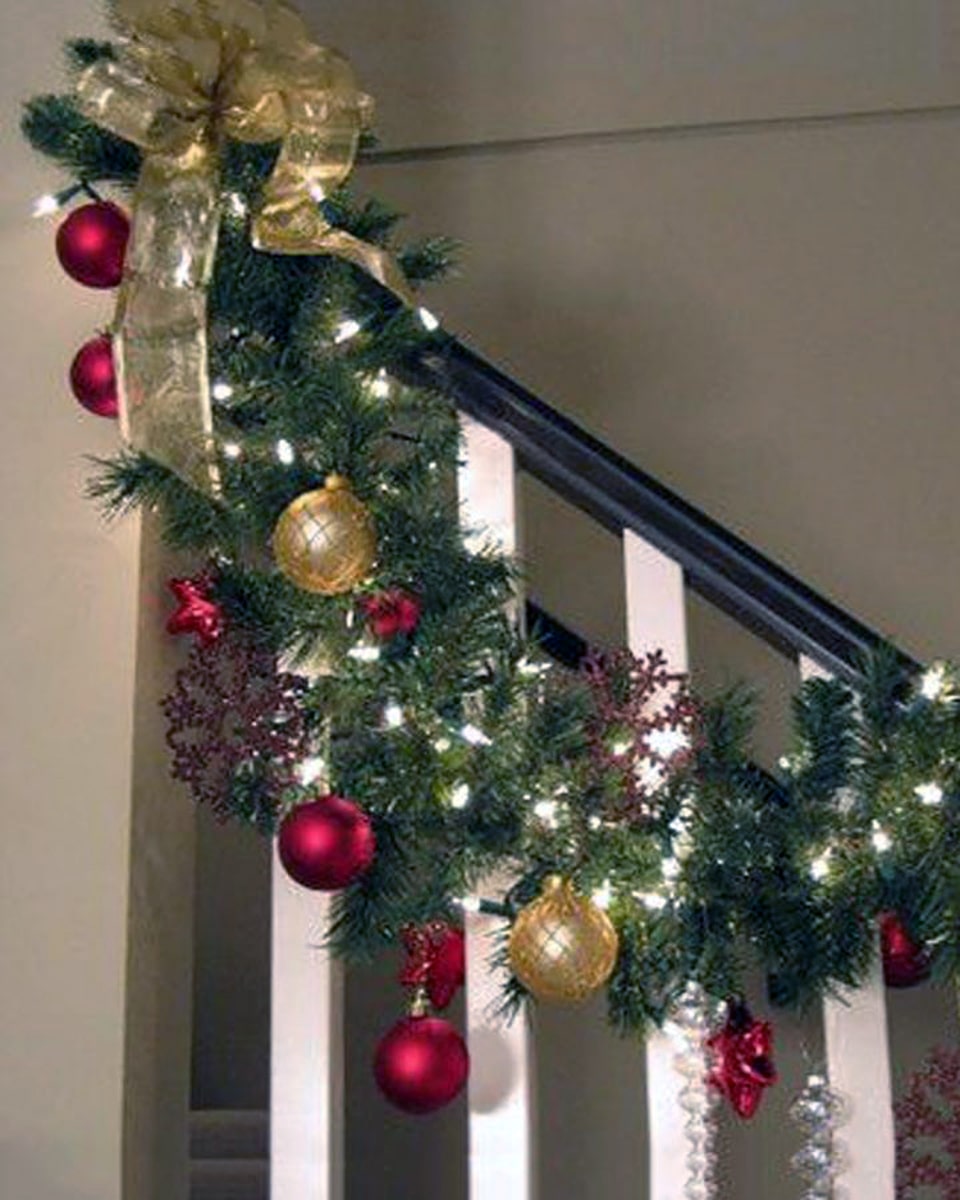 Staircase Garland 10 feet Douglas Fir Garland is decorated with assorted Christmas Balls, Gold Bow Ribbons, Stars, assorted Christmas Decorations, and Christmas Lights.
DELIVERY: Every order is hand-delivered direct to the recipient. These items will be delivered by us locally, or a qualified retail local florist.