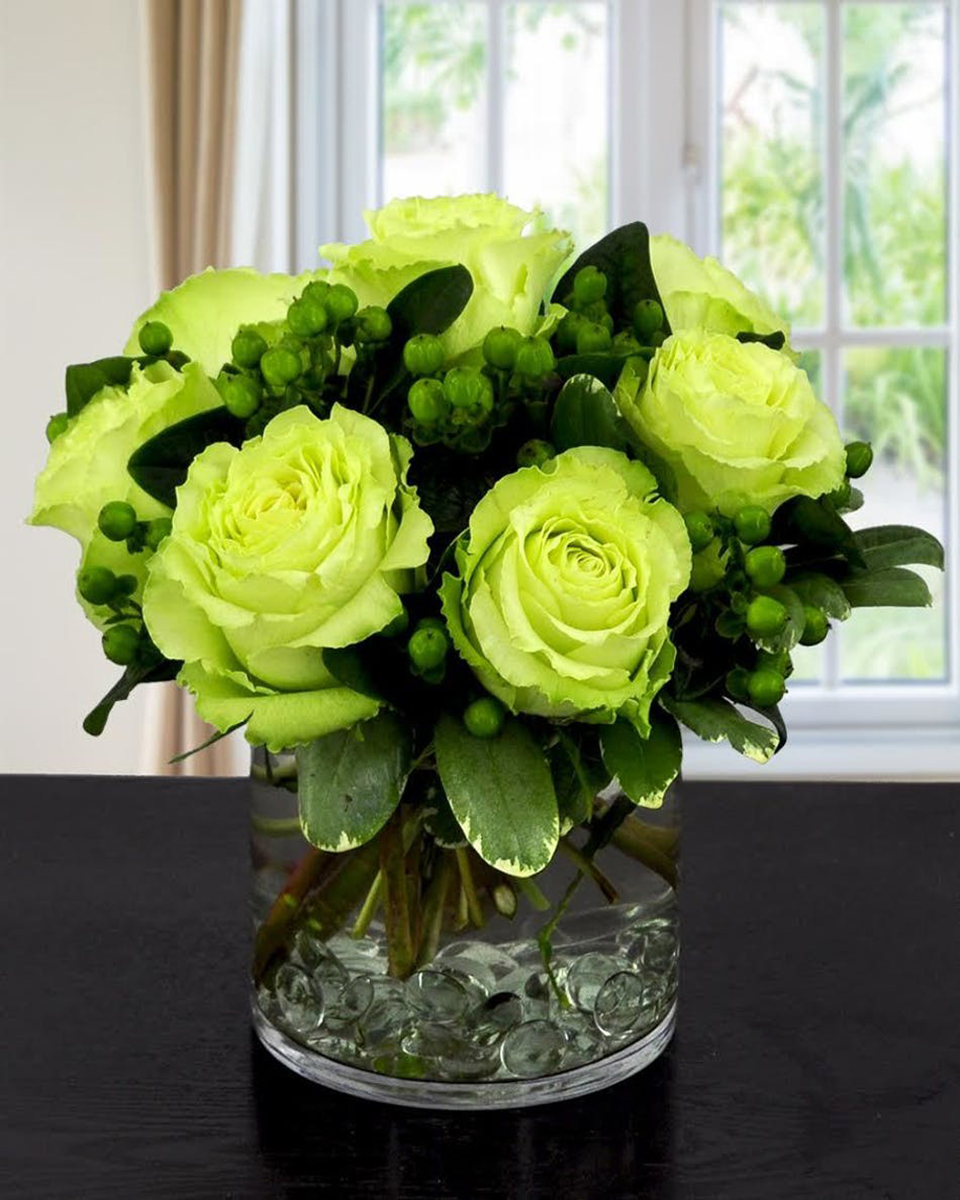 Lady Luck Lady Luck-Standard (In a 5 x 5 In Cylinder) Beautiful Lemonada Roses are arranged with Green Hypericum and Pittosporum in a 5 x 5 cylinder that is lined with clear acrylic stones.
DELIVERY: Every order is hand-delivered direct to the recipient. These items will be delivered by us locally, or a qualified retail local florist.