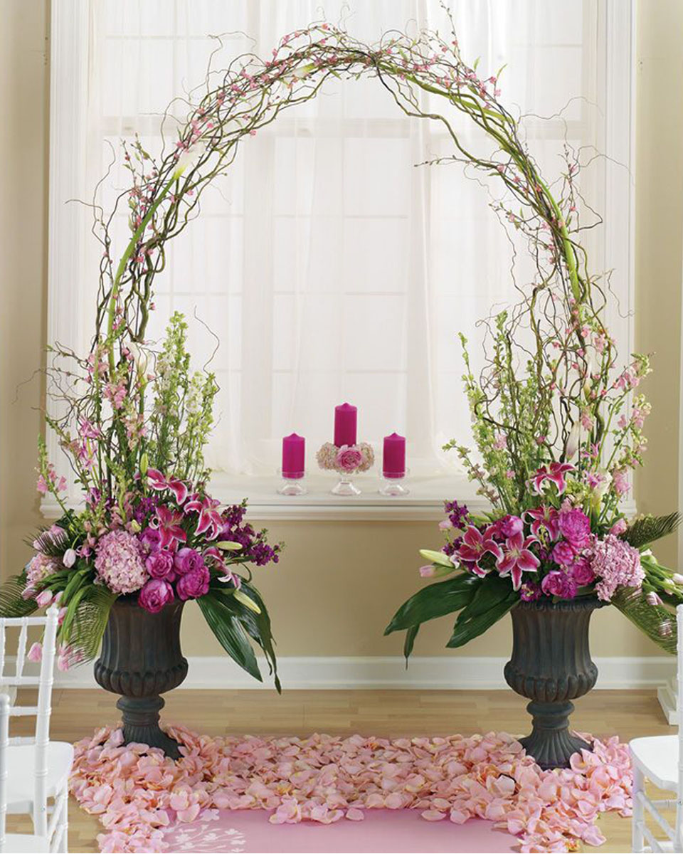 Wedding Arch Wedding Arch This Wedding  Arch incorporates  2 Urn Vase Arrangements  that anchor a Curley Willow Arch