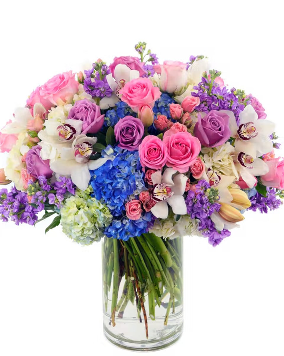 Garden Beauty Deluxe Send an abundance of love with this stunning work of art comprised of premium floral varieties, including Hydrangea, Roses, Spray Roses, Orchids, Lavender and more! * Flowers & colors may vary slightly.
DELIVERY: Every order is hand-delivered direct to the recipient. These items will be delivered by us locally, or a qualified, retail, local florist.

