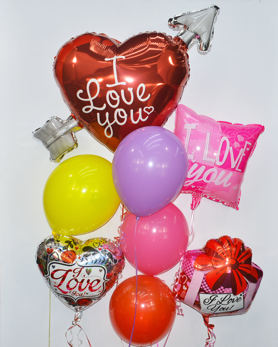 Love Balloon Bouquet Deluxe Assorted mylar and latex balloons are arranged into a balloon bouquet attached to a gift bag weight.