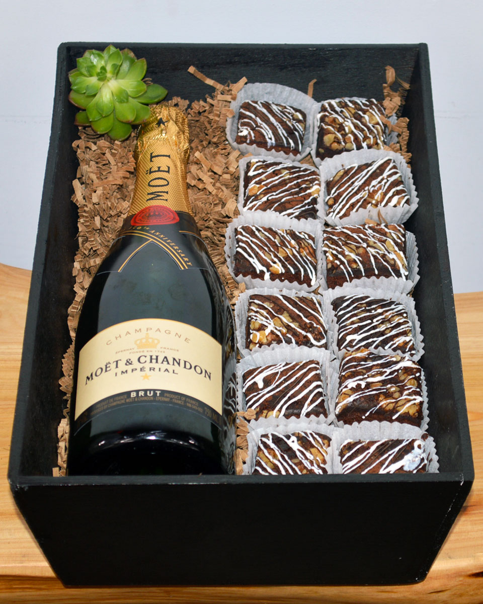 Champagne and Brownies Moet & Chandon Champagne Delicious, mouth watering Brownies are paired with Wine or Champagne in a Wood gift box. The brownies are baked daily by Babbette Bakery, one of the top bakeries in Long Beach.  
Please give us at least a 24 hour notice on these products to insure quality and freshness.
DELIVERY: Every order is hand-delivered direct to the recipient. This item is only deliverable to local areas serviced by the Allen’s Flower Market chain and its affiliates.