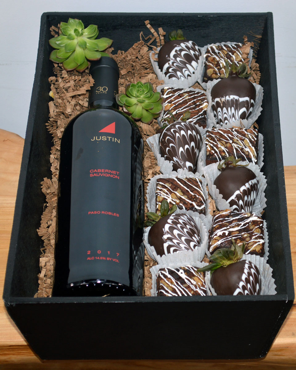 Champagne, Strawberries, And Brownies Justin Cabernet Sauvignon Fresh, Mouth watering chocolate brownies and irrisistable chocolate covered strawberries are paired with Wine or Champagne of your choice and crafted inside a gift wooden box. The brownies and chocolate covered strawberries are made daily by Babbette Bakery, one of Long beach's finest and oldest bakeries.
Please give at least a 24 hour notice when ordering these products. This helps insure the freshness and quality. The brownies contain nuts.
DELIVERY: Every order is hand-delivered direct to the recipient. This item is only deliverable to local areas serviced by Allen’s Flower Market Stores. 