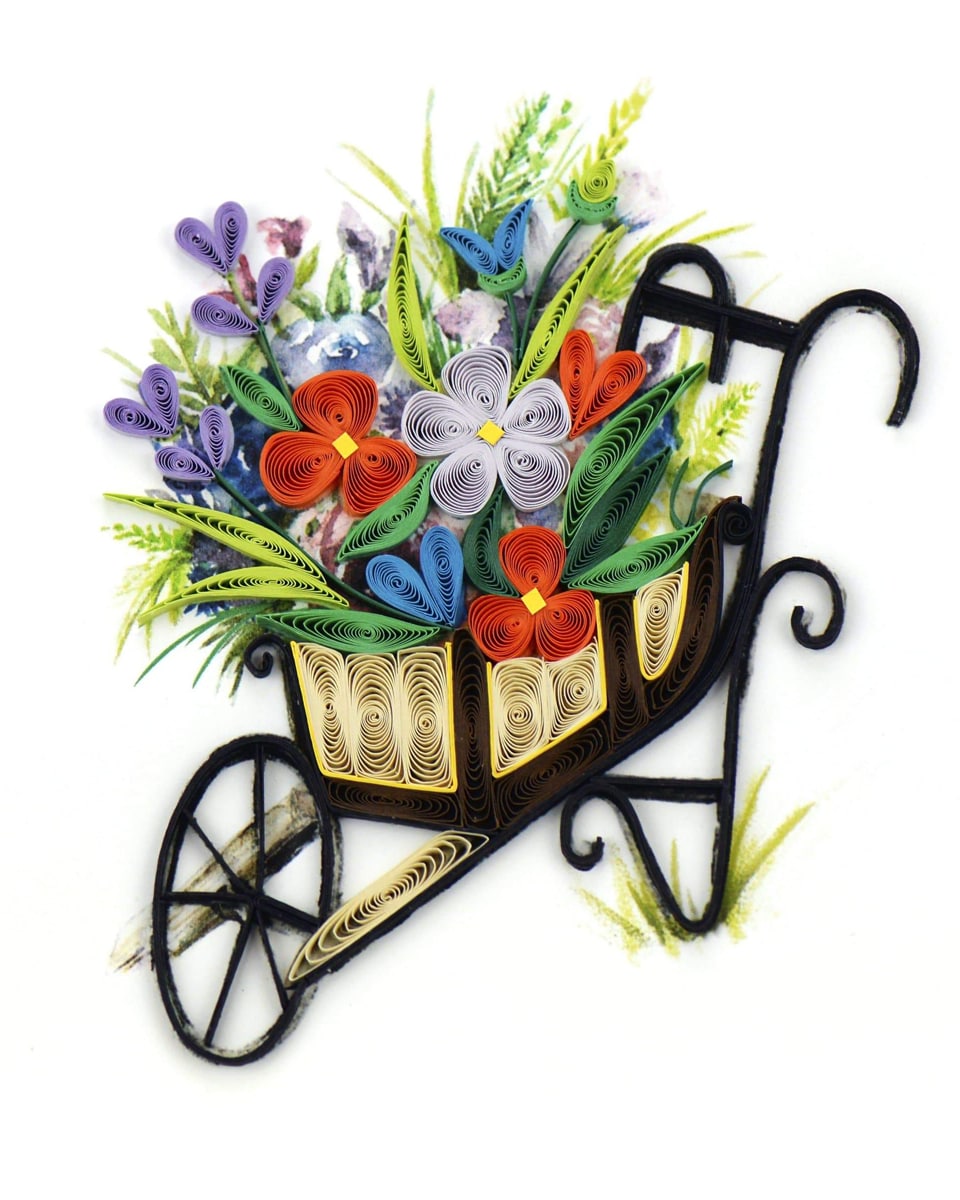 Wheel Barrell Greeting Card Wheel Barrell Card The perfect card for you to send to a friend with a green thumb! Our Quilled Wheelbarrow Garden Greeting Card depicts a brown wheelbarrow with flowers inside of it. The flowers are in vibrant hues of purple, red, blue, yellow and green.  Each quilled card is beautifully handmade by a highly skilled artisan and takes one hour to create. A quilled card is meant for you to share, treasure as a keepsake, or display as the work of art it is.  Certified Fair Trade Federation Member  Don’t just send a card, send art!