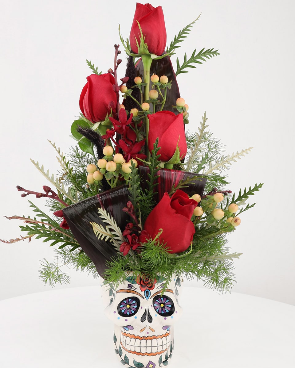 Day of the Dead Arrangement Standard Celebrate Dia De Los Muertos with a arrangement of Roses,  orchids, and complimentary foliage in a keepsake Day of the Dead Keepsake Mug.
 
Local florist only
DELIVERY: Every order is hand-delivered direct to the recipient. This item is only deliverable to local areas serviced by Allen’s Flower Market Stores. 