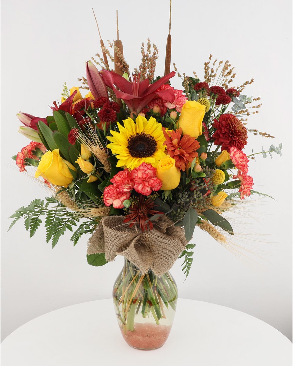 Fall Sonnet Standard Beautifull, lucious fall foliage and flowers are elegantly crafted into a glass vase that reflect the colors and hues of autumn. A perfect gift for the fall holidays.
Every order is hand-delivered direct to the recipient. These items will be delivered by us locally, or a qualified retail local florist.
 