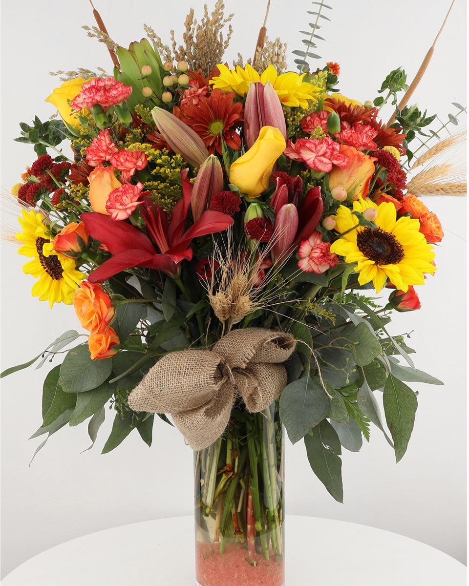 Fall Sonnet Deluxe Beautifull, lucious fall foliage and flowers are elegantly crafted into a glass vase that reflect the colors and hues of autumn. A perfect gift for the fall holidays.
Every order is hand-delivered direct to the recipient. These items will be delivered by us locally, or a qualified retail local florist.
 