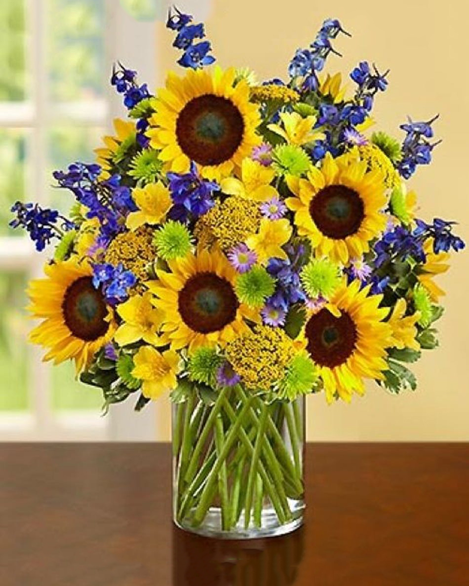Suns of Belmont Shore Standard Vibrant sunflowers, striking ocean blue delphinium, exotic alstroemeria and more merge to transport your special someone to the vast feelings of the blue Pacific Ocean while sitting in the soft Belmont Shore sand.
DELIVERY: Every order is hand-delivered direct to the recipient. These items will be delivered by us locally, or a qualified retail local florist.