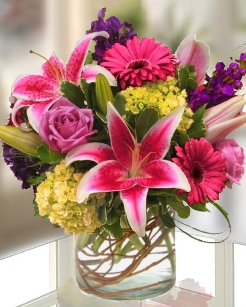Allens Garden of Spring Allens Garden of Spring-Standard (in a 6 x 6 Cylinder) Garden favorites like stargazer lilies, gerbera daisies, fragrant purple stock, and garden roses artfully designed in a chic ginger glass vase. A beautiful gift for any occasion.
DELIVERY: Every order is hand-delivered direct to the recipient. These items will be delivered by us locally, or a qualified retail local florist.