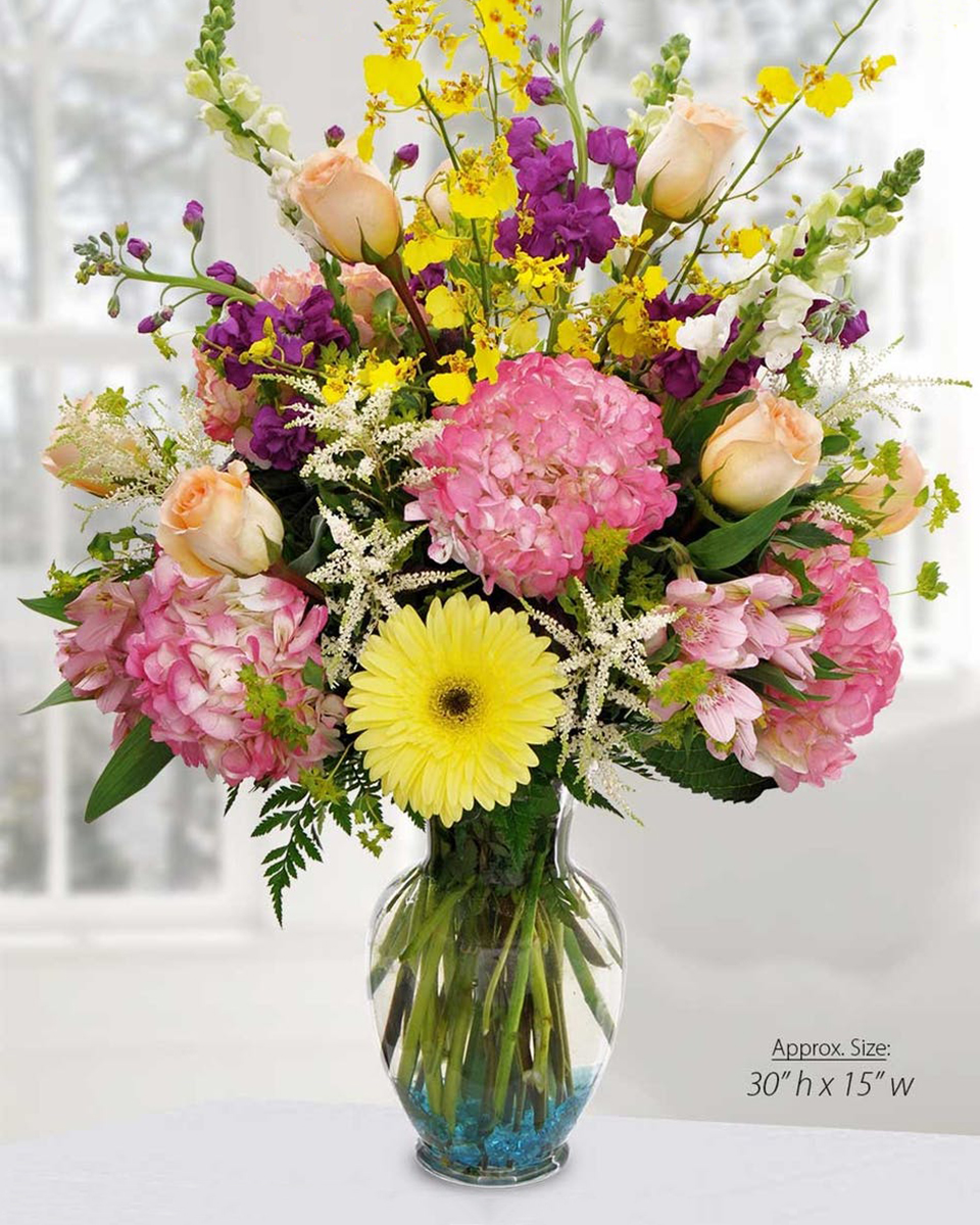 Pastoral Pastels Standard A beautiful array of pastel hydrangeas, gerbera daisies, roses, snapdragons, orchids, and stock are spectacularly designed in a garden vase.
DELIVERY: Every order is hand-delivered direct to the recipient. These items will be delivered by us locally, or a qualified retail local florist.