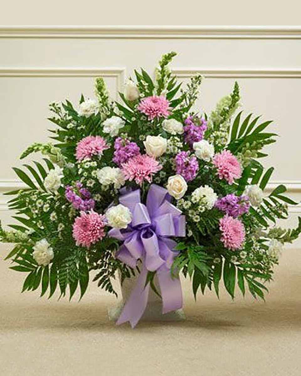 Heartfelt Sympathy Basket Deluxe This arrangement features a variety of the freshest flowers in lavender and white. This arrangement is a lovely expression of your sympathy. Standard arrangement measures approximately 28
