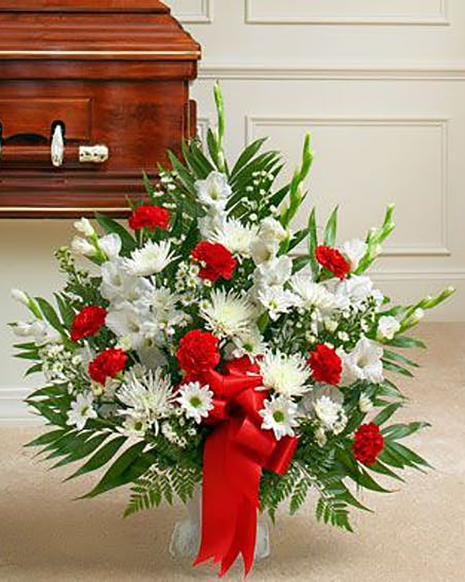 Sincere Sympathy Basket Standard Always popular, a sympathy basket is a fitting expression and tribute to a loved one. Red & White basket contains a mix of red roses, mini carnatons, gladiolas and more.Premium arrangement measures approximately 32
