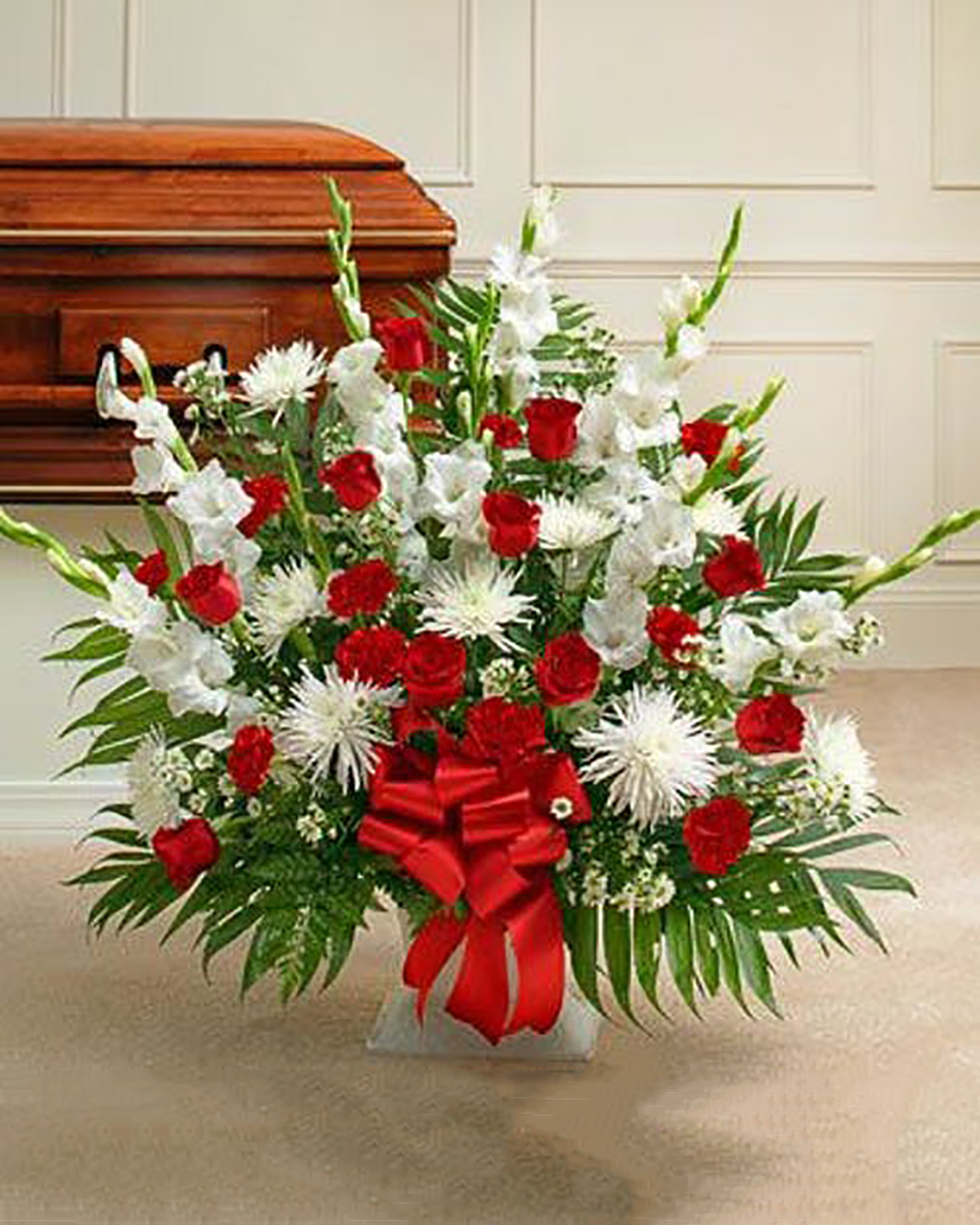 Sincere Sympathy Basket Premium Always popular, a sympathy basket is a fitting expression and tribute to a loved one. Red & White basket contains a mix of red roses, mini carnatons, gladiolas and more.Premium arrangement measures approximately 32