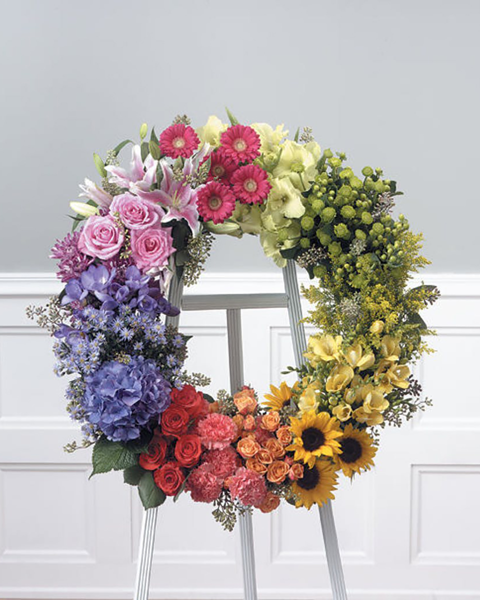Halo of Memories Standard (24 Inch) Glorious colors in seasonal flowers form a wreath of thoughtful remembrance!This wreath includes a mixture of seasonal flowers and colors. Some of these flowers will vary depending on the season. Appropriate for the funeral home.
DELIVERY: Every order is hand-delivered direct to the recipient. These items will be delivered by us locally, or a qualified retail local florist.