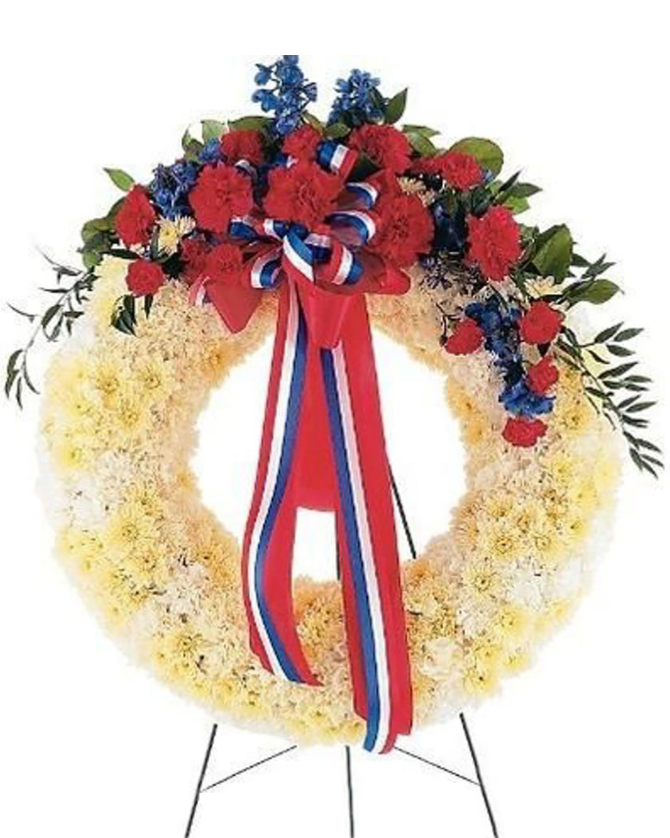Patriotic Wreath Deluxe (24 Inch) This wreath with its red, white and blue flowers displays its patriotic spirit to all.Arrangement Details:One solid white wreath arrives on an easel decorated with red carnations and blue delphinium, along with a patriotic red, white and blue ribbon.
DELIVERY: Every order is hand-delivered direct to the recipient. These items will be delivered by us locally, or a qualified retail local florist.