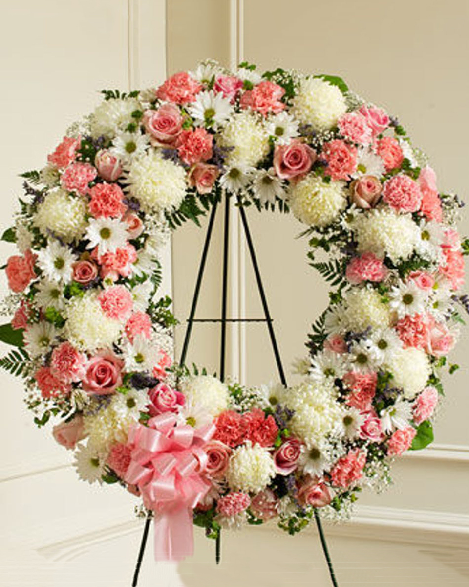 Serene Blessings Premium (30 Inch) Standing Wreath on an easel consisting of White China Mums, White Daisy Mums, Pink roses, Pink Carnations, Babys Breath, and assorted Greens.
DELIVERY: Every order is hand-delivered direct to the recipient. These items will be delivered by us locally, or a qualified retail local florist.