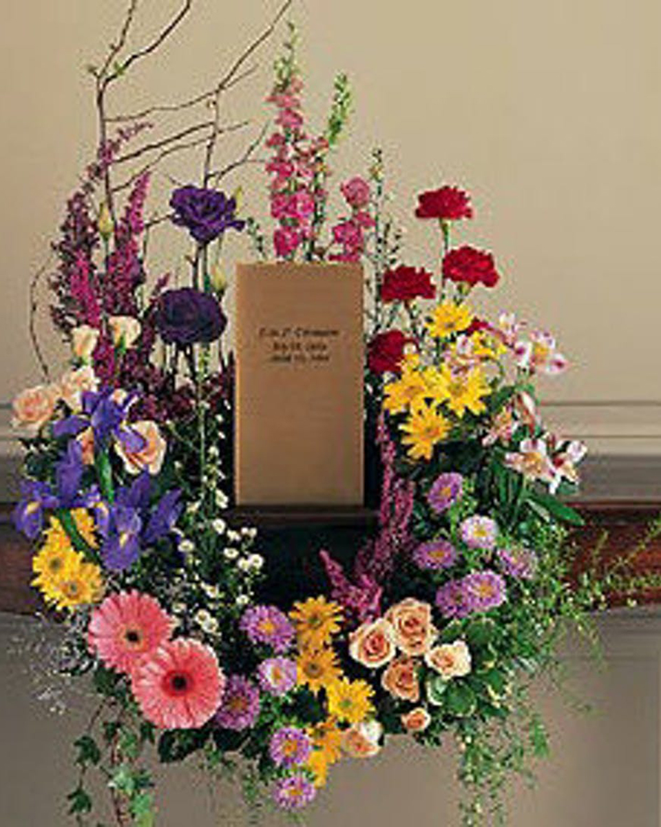 Cremation Urn Design Standard-18 in This beautiful wreath with its eternally vibrant spring flowers respectfully adorns a cremation urn. Designed to surround a cremation urn and contains nicest available spring colors and flowers.
DELIVERY: Every order is hand-delivered direct to the recipient. These items will be delivered by us locally, or a qualified retail local florist.