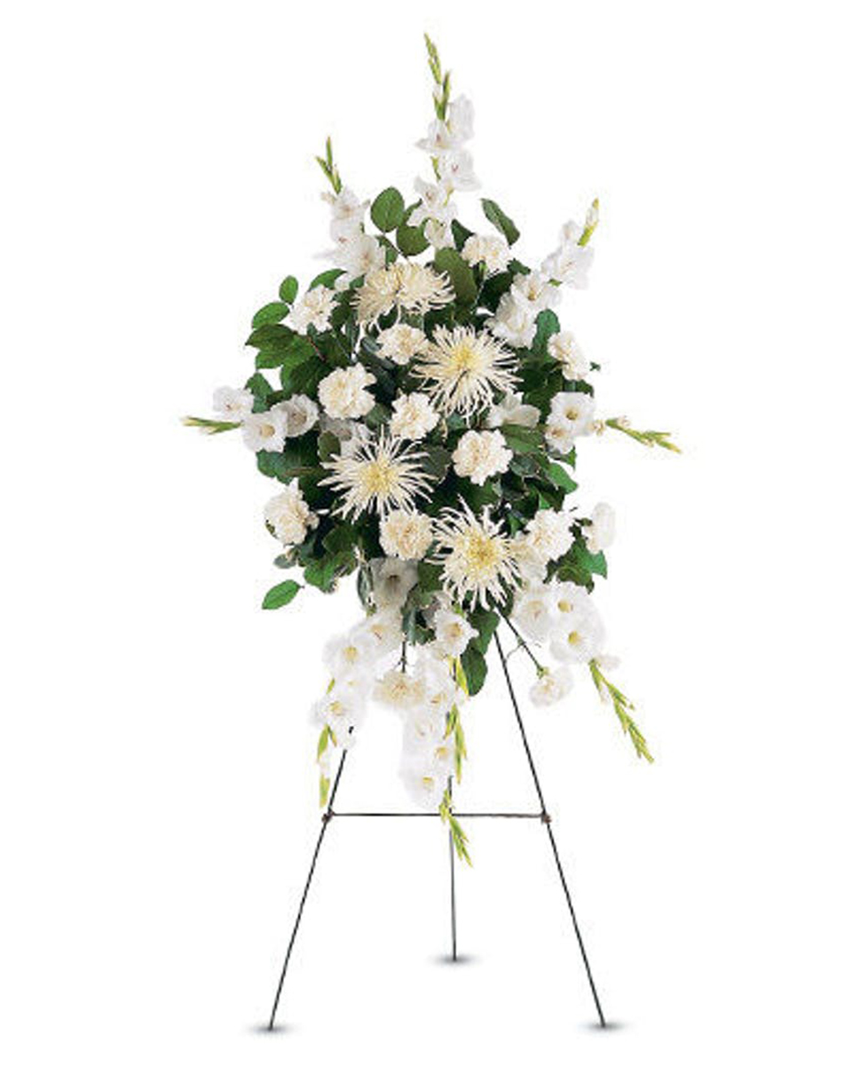 White Promises Spray White Promises Spray- Deluxe This traditional spray, filled with white carnations, chrysanthemums and gladoli, makes the promise that love is eternal.
DELIVERY: Every order is hand-delivered direct to the recipient. These items will be delivered by us locally, or a qualified retail local florist.