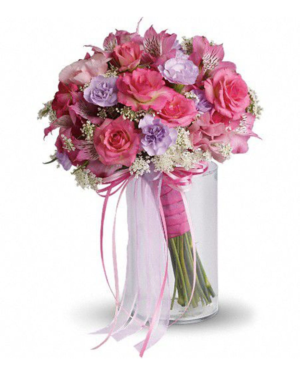 Pastel Bridal Bouquet Standard Pink Roses, Lavender Mini carnations, Pink Alstroemaria, and Queen Annes Lace are arranged then Wrapped in Pink Ribbon.
DELIVERY: Every order is hand-delivered direct to the recipient. These items will be delivered by us locally, or a qualified retail local florist.