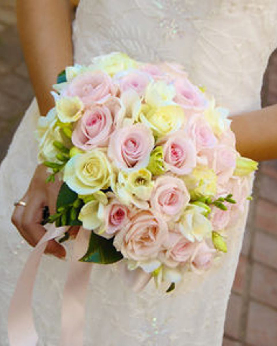 The Rose Bridal Bouquet Standard This Bridal Bouquet consists of Pink Roses, Jade Roses, Spray Roses, and Freesia that are hand tied by a Pink Ribbon.
DELIVERY: Every order is hand-delivered direct to the recipient. These items will be delivered by us locally, or a qualified retail local florist.