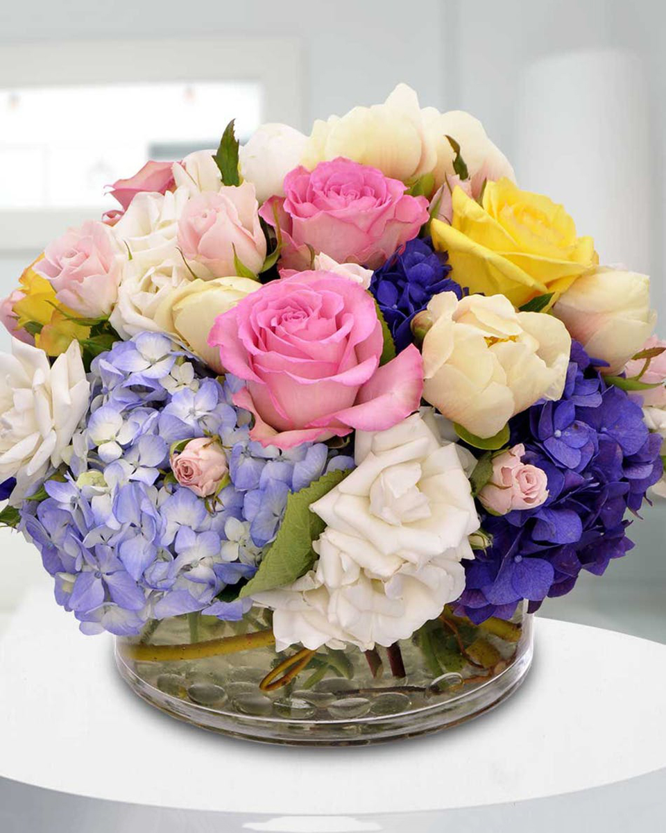 Rosita Standard Assorted roses, spray roses, hydrangea, and tulips are elegantly designed in a low cylinder vase.
DELIVERY: Every order is hand-delivered direct to the recipient. These items will be delivered by us locally, or a qualified retail local florist.