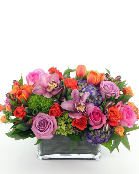 SPRING LOVE-Featuring a lush array of bright roses, hydrangea, tulips, orchids, dianthus and more, this versatile design is presented in a low glass container making it an ideal centerpiece or perfect to brighten any coffee table, counter, desk or space.-