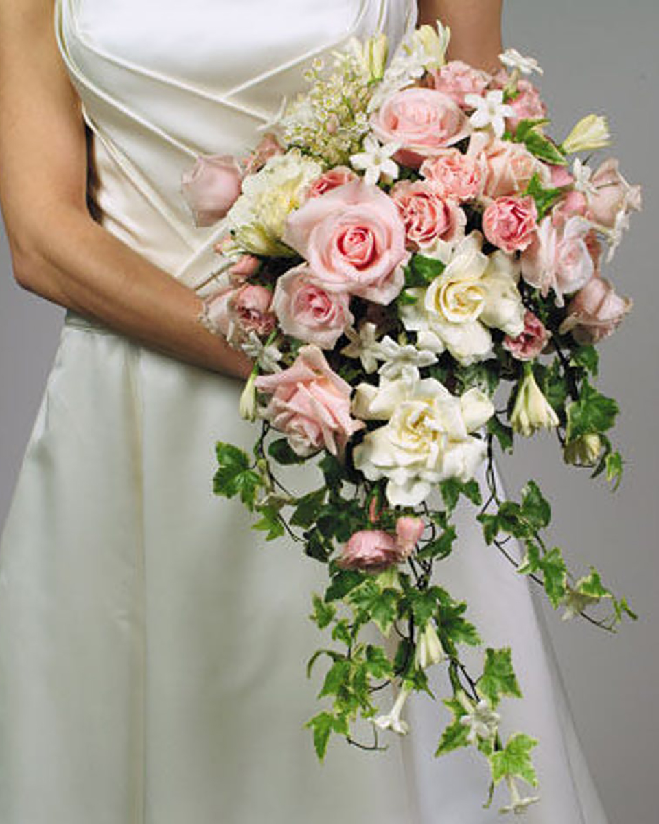 Philadelphia Bouquet Standard Gardenia, Stephanotis, Pink Roses, Spray Roses, Queen Annes Lace, Tubberrose, and Variegated Ivy are designed into a Classic Cascading Wedding Bouquet.
DELIVERY: Every order is hand-delivered direct to the recipient. These items will be delivered by us locally, or a qualified retail local florist.